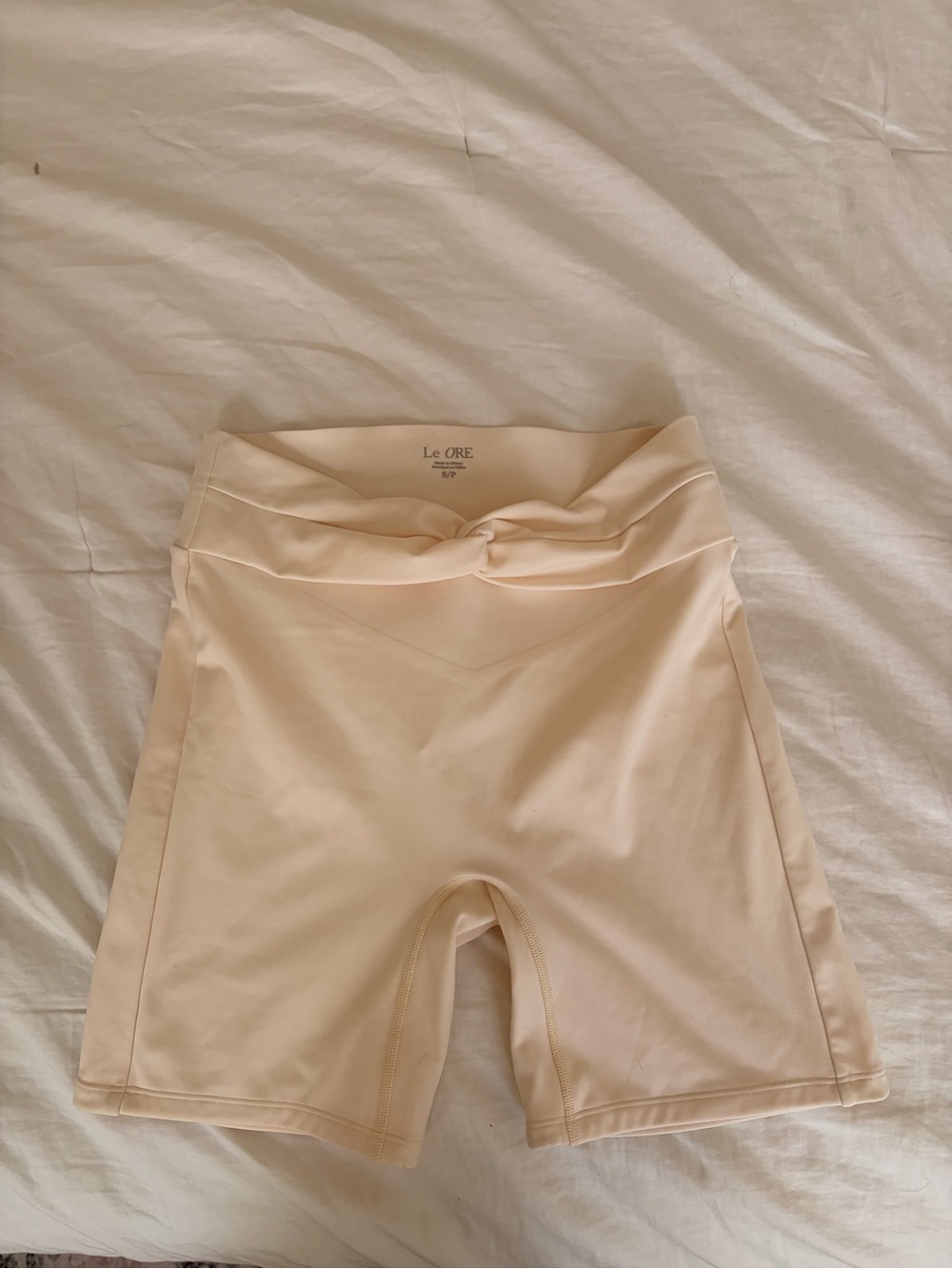 Le Ore Cream High-Rise Knot-Front Bike Shorts